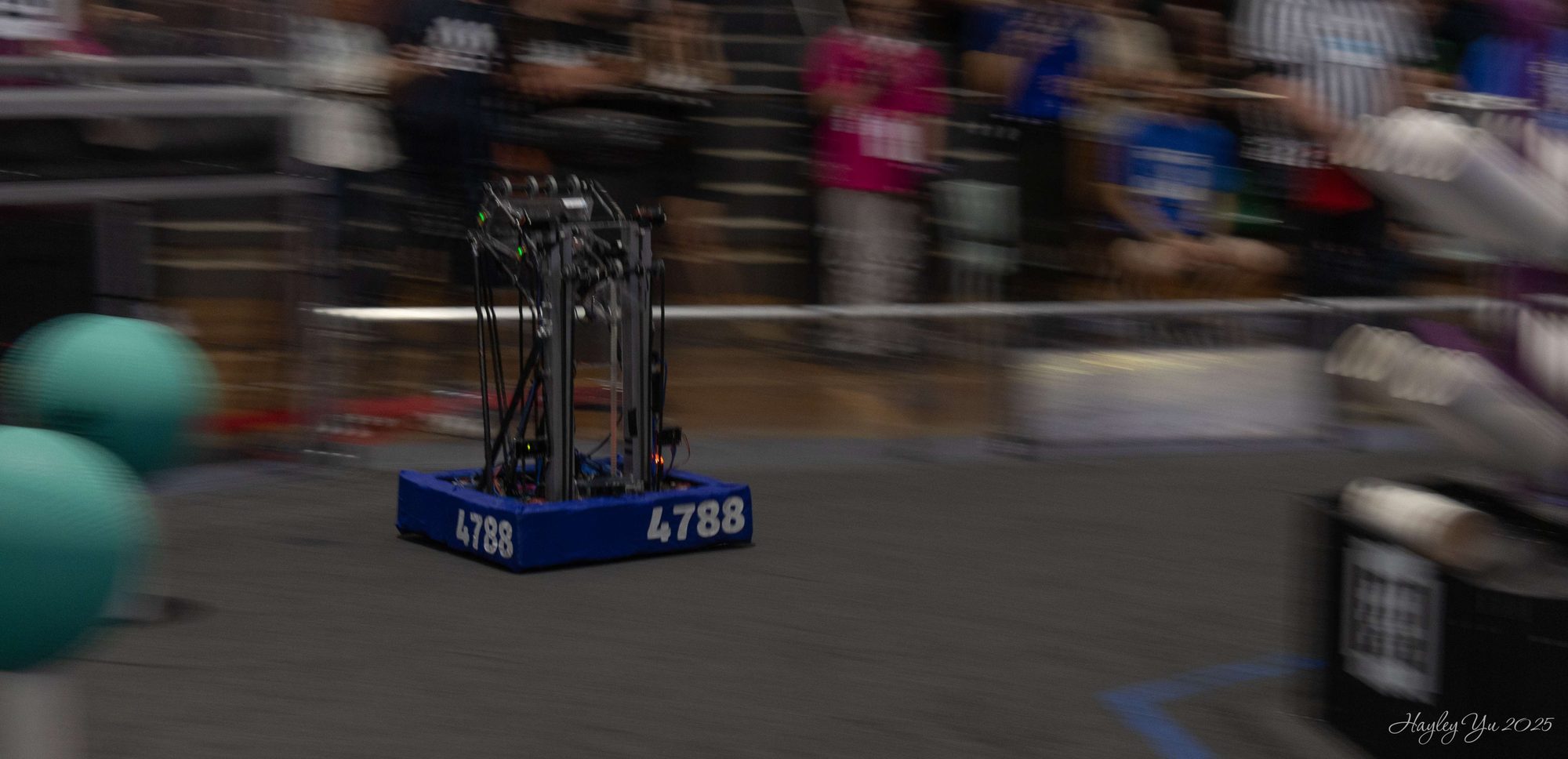 Team 4788's robot driving across the field during a match