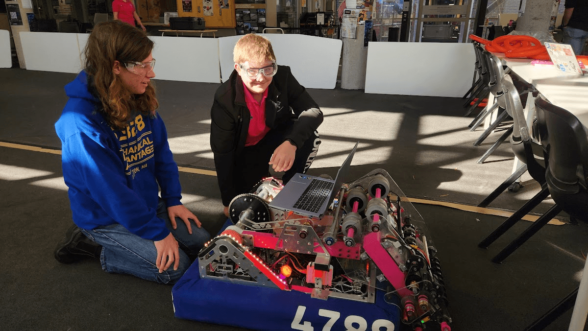 Two team members working on the robot
